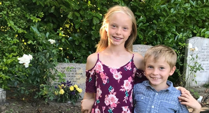 The author's children stand near the grave of their great-grandmother and great-grandfather, for whom they were named.Courtesy of the author