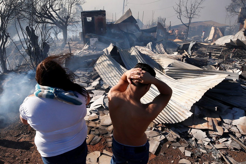 A house burns following the spread of wildfires in Valparaiso