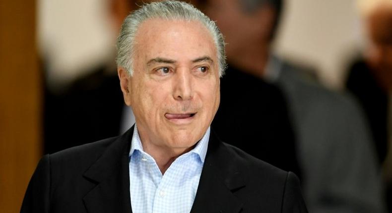 Brazilian President Michel Temer arrives to offer a press conference at Planalto Palace in Brasilia, on November 27, 2016