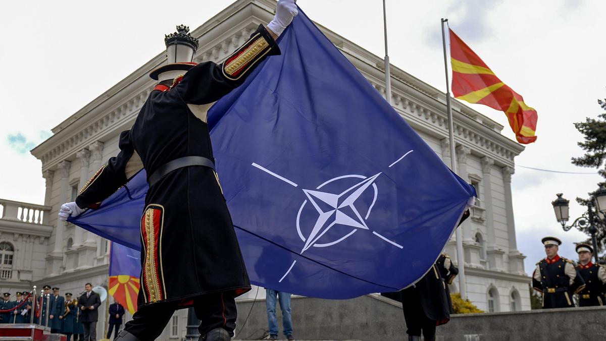NATO flag hoisted alongside Macedonian flag at government building in Skopje