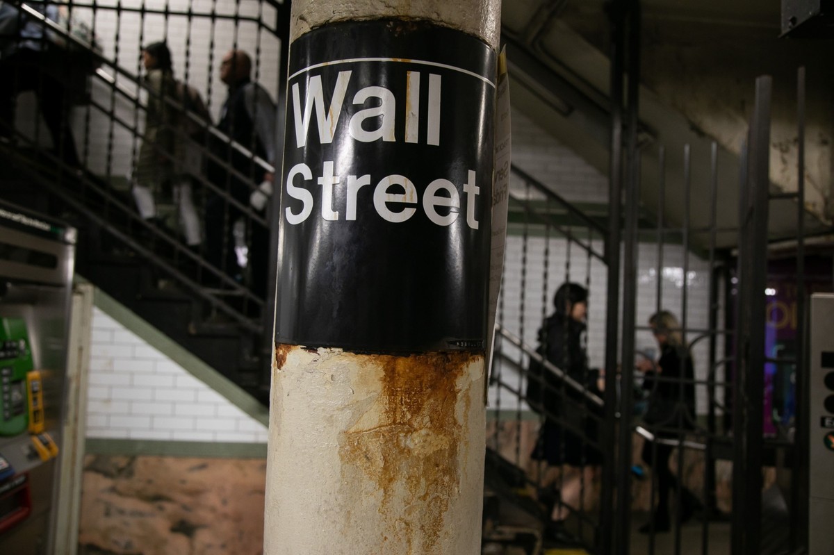 Commuters exit a Wall Street subway station near the New York Stock Exchange (NYSE) in New York, US, on Friday, Oct. 20, 2023.