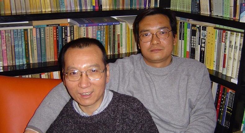 A file picture released by the family of Liu Xiaobo taken on March 14, 2005 shows 2010 Nobel peace laureate Liu Xiaobo, left, and his brother Liu Xiaoxuan