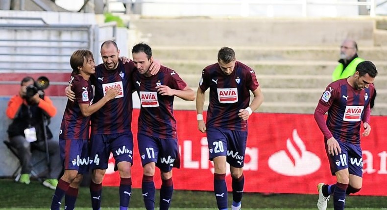 Eibar's defender Ivan Ramis (2nd L) celebrrates with teammates after scoring on October 30, 2016