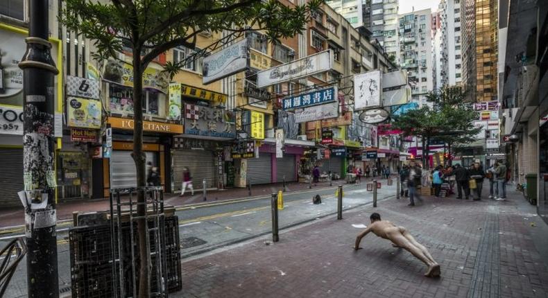 Ou Zhihang's photographs himself exercising nude at sites such as the Hong Kong bookstore linked to the disappearance of five booksellers