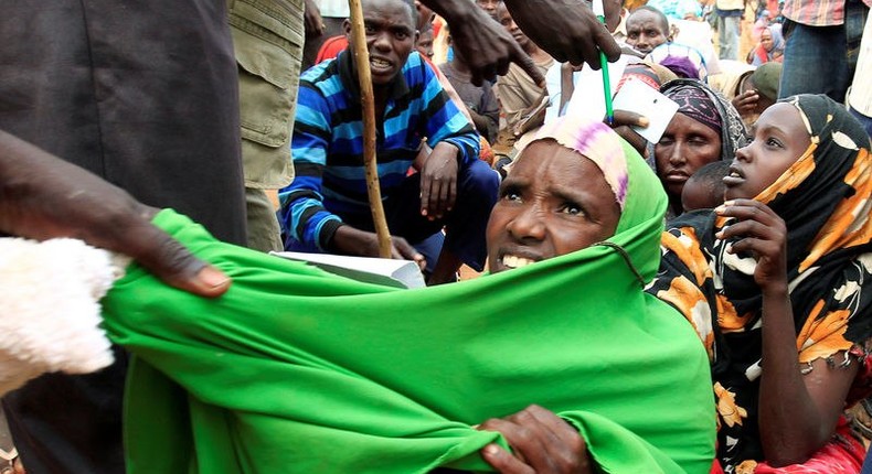 A newly arrived Somali refugee is forced out of the queue outside a reception centre in the Ifo 2 refugee camp in Dadaab, near the Kenya-Somalia border, in Garissa County, Kenya July 28, 2011. REUTERS/Thomas Mukoya/File Photo