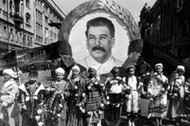 9th May 1938, Kiev, Russia, Children carry a portrait of Russian dictator and revolutionary Joseph S