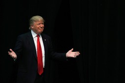 U.S. Republican presidential candidate Trump reacts as he is introduced during a campaign event in C