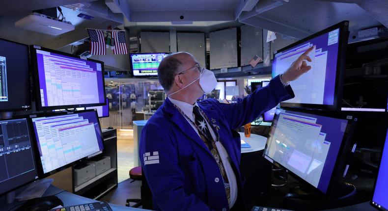 A trader works on the trading floor on the last day of trading before Christmas at the New York Stock Exchange (NYSE) in Manhattan, New York City, U.S., December 23, 2021.