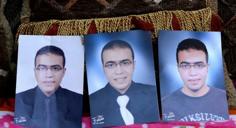 Portraits of Abdallah El-Hamahmy, an Egyptian suspected of being the machete attacker in Paris's Louvre museum, placed on a sofa at the family home in the Nile delta city of Mansura, some 120 kms north of Cairo