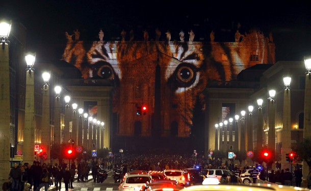 A picture of a tiger, part of an art projection featuring images of humanity and climate change arti