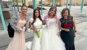Loreal Hemenway and Stephanie Osmundson with two other teachers who wore bridesmaids dresses for the dress up day.Courtesy Loreal Hemenway and Stephanie Osmundson