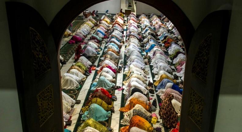 Indonesian Muslims pray during the start of the holy month of Ramadan. More than 1.5 billion Muslims around the world will mark the month, during which believers abstain from eating, drinking, and smoking from dawn until sunset