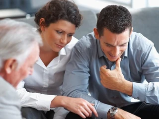 Banking agent explaining an investment scheme to a couple