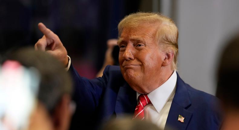 Former President Donald Trump mingles with supporters in Clinton, Iowa.AP Photo/Charlie Neibergall