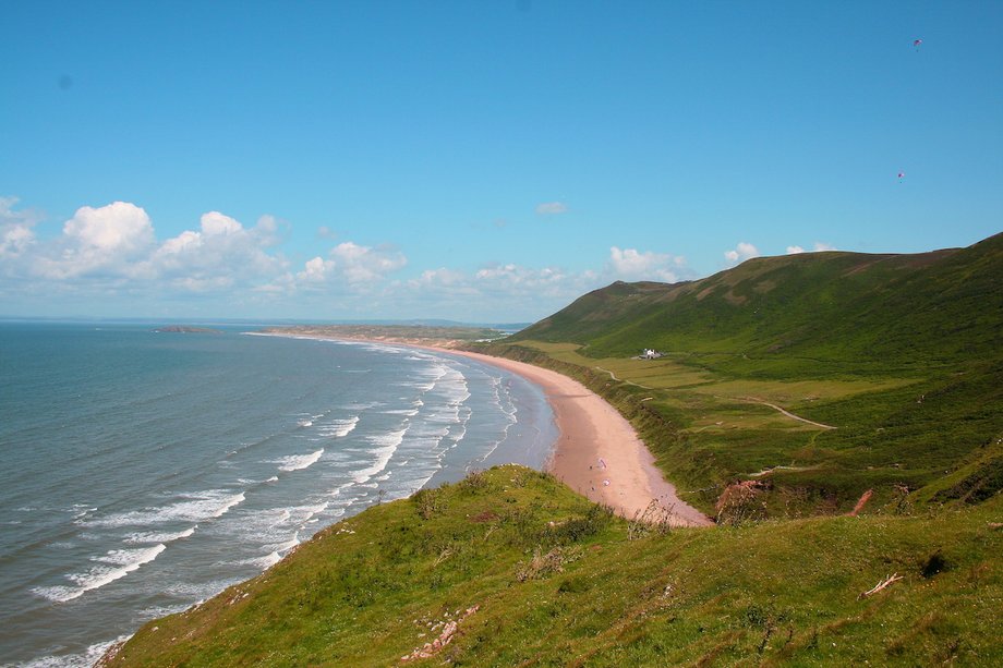 4. Rhossili Bay — Rhossili, Wales: This "clean, long, sandy beach" is favoured by hikers with an "amazing cliff walk along Worm's Head," while surfers head here for "big waves."