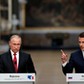 French President Emmanuel Macron and Russian President Vladimir Putin give a joint press conference at the Chateau de Versailles before the opening of an exhibition marking 300 years of diplomatic ties between the two countries in Versailles