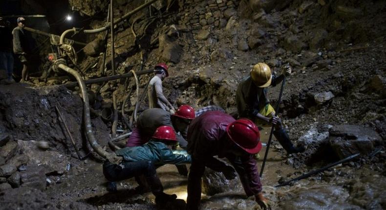 Miners work inside a ruby mine in Mogok, Myanmar