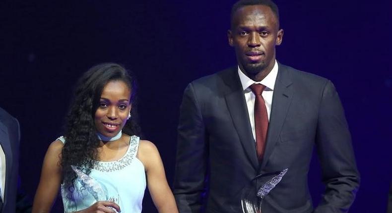 Usain Bolt of Jamaica (R) and Almaz Ayana of Ethiopia pose with their awards after being elected male and female World Athlete of the Year 2016 in Monaco, December 2, 2016.  REUTERS/Eric Gaillard
