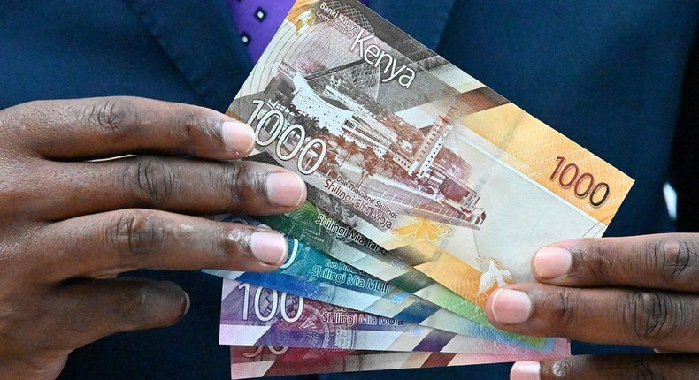 [FILE] Central Bank of Kenya (CBK) governor Patrick Njoroge displays some of the new designs for the Kenyan currency notes in 2019. 