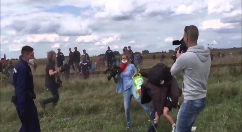 Hungarian TV journalist fired for tripping up fleeing migrants