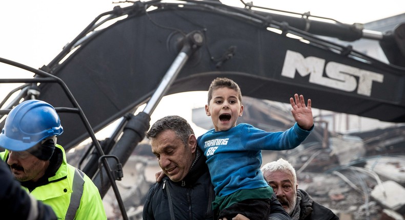 Rescue workers carry 8-year-old survivor Yigit Cakmak at the site of a collapsed building on February 08, 2023 in Hatay, Turkey.Burak Kara/Getty Images