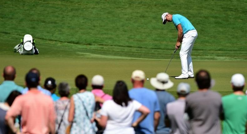 Henrik Stenson of Sweden attempts a putt on the eighth green during the third round of the Wyndham Championship, at Sedgefield Country Club in Greensboro, North Carolina, on August 19, 2017