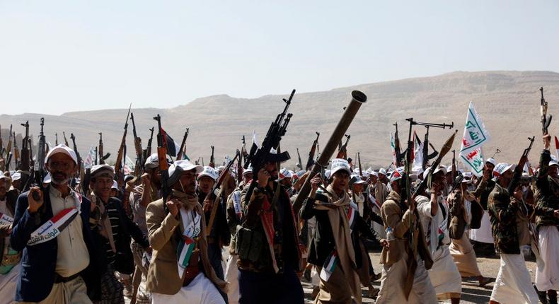 Houthi loyalists show off their weapons in Amran province, Yemen, on December 20, 2023.Mohammed Hamoud