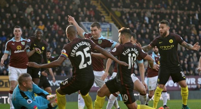 Manchester City's Sergio Aguero (3R) came up with the goals at Burnley that rescued three points for City after they had fallen behind