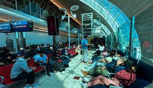 Passengers wait for their flights at the Dubai International Airport on April 17.AFP/Getty