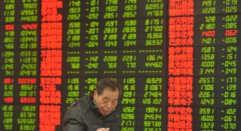 An investor looks at a computer screen showing stock information at a brokerage house in Fuyang, Anhui province, January 28, 2016. REUTERS/China Daily