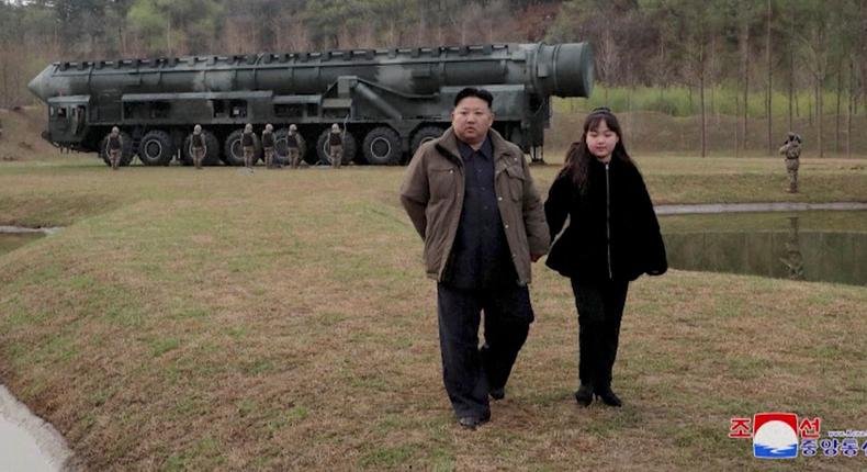 North Korean leader Kim Jong Un and his daughter Kim Ju Ae attend a test launch of a new solid-fuel intercontinental ballistic missile (ICBM) Hwasong-18 at an undisclosed location in this still image of a photo used in a video released by North Korea's Korean Central News Agency (KCNA) April 14, 2023.KCNA via REUTERS