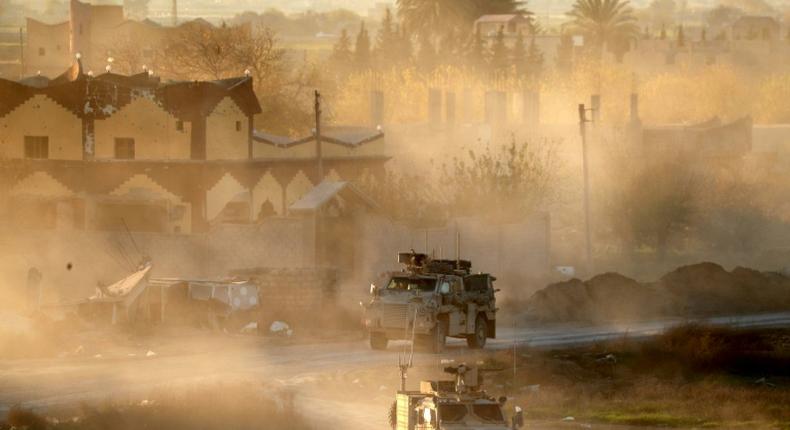 US army vehicles supporting the Syrian Democratic Forces (SDF) pictured in Hajin, eastern Syria, on December 15, 2018