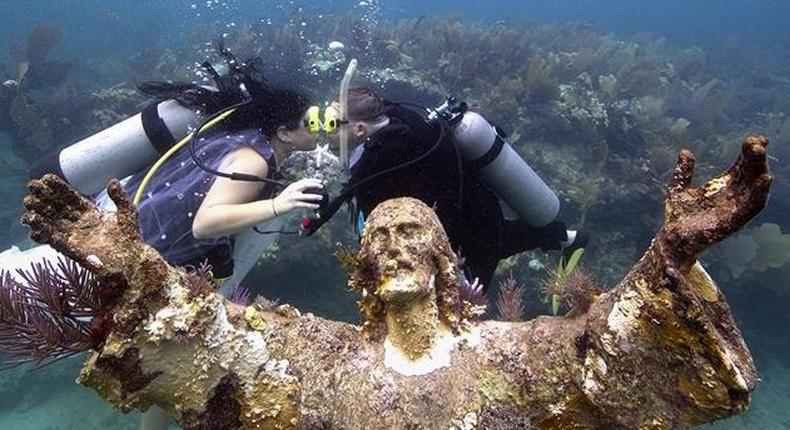 Kimberly Triolet and Jorge Rodriguez got married Tuesday beside the Christ of the Deep statue in the Florida Keys