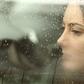 Sad woman looking through a car window