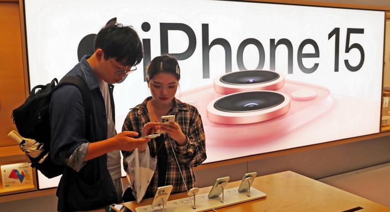 Customers trying out Apple's iPhone 15 at an Apple store in Shanghai, China.CFOTO/Future Publishing via Getty Images