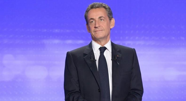 Candidate for the right-wing party primaries ahead of the 2017 presidential election former French president Nicolas Sarkozy prepares to take part in a televised debate at the studios of France 2 in Paris on November 17, 2016