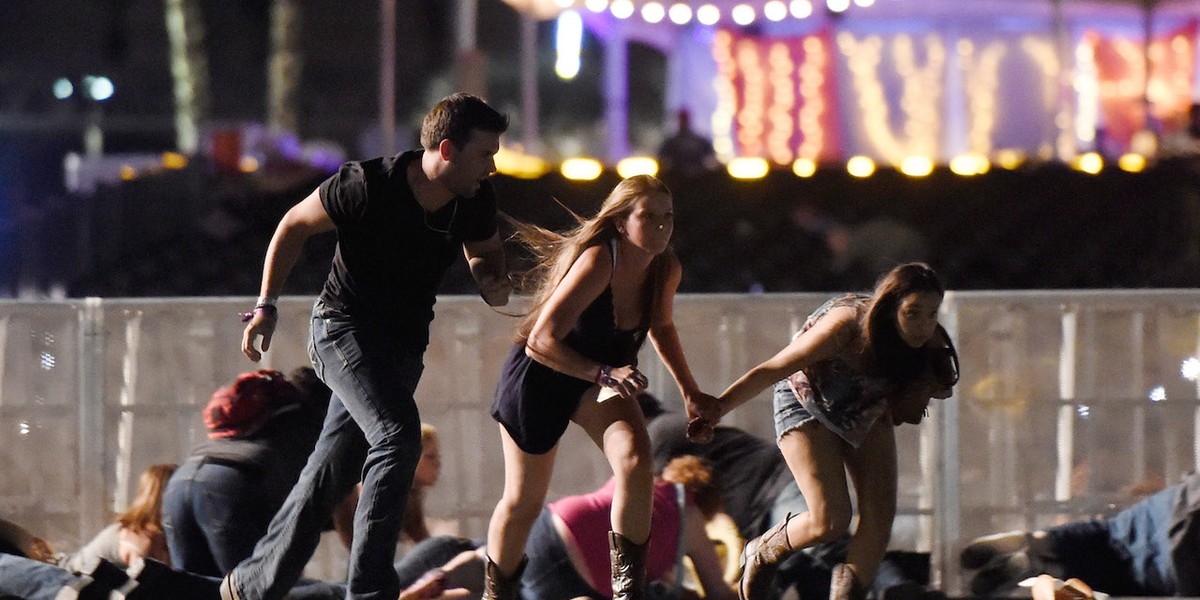 Concertgoers flee gunfire at a country-music festival in Las Vegas, October 1, 2017.