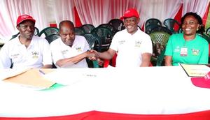 Dr. Martin Aliker (2nd L) shakes hands with the Vice Chancellor, Prof. Barnabas Nawangwe (2nd R) at the successful conclusion of the Second Edition of the Makerere University Endowment Fund (MakEF) Run (MakRun) on Sunday, March 25, 2018 as Prof. William Bazeyo (L) and Dr. Florence Nakayiwa (R) witness.