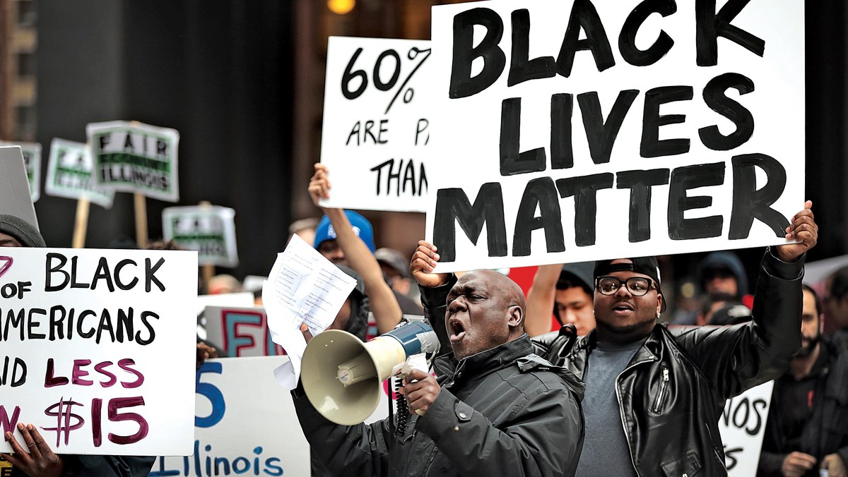 Black Lives Matter Protesters Join Living Wage Activists For Rally And March In Chicago