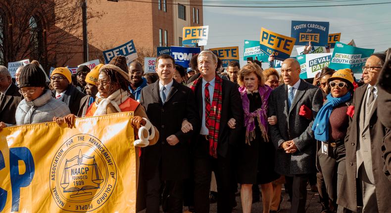 On King Holiday, 2020 Democrats March Arm in Arm to Honor His Legacy