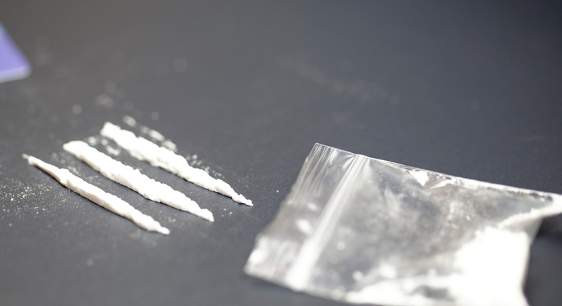 A stock photo shows a bag of cocaine with lines of the drug.Getty Images