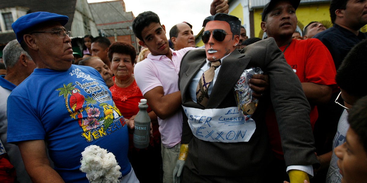 A model called "Mr. Exxon" is hung before being burnt during Easter Sunday celebrations in Caracas, March 23, 2008. In Venezuela, people burn this "Judas" every year representing a political situation. A week prior, a British judge lifted a $12 billion freeze on Venezuelan assets awarded to US oil major Exxon Mobil in a spat over a seized oil project.