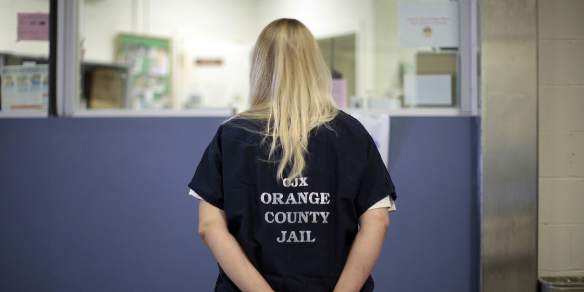 An inmate is checked into the Orange County jail in Santa Ana, California, May 24, 2011.