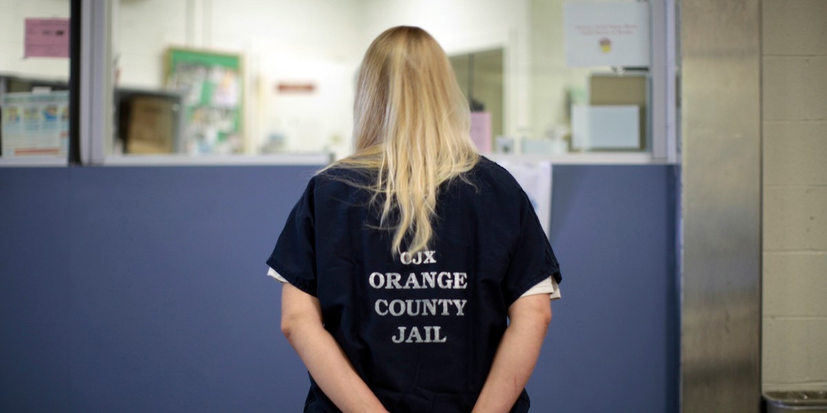 An inmate is checked into the Orange County jail in Santa Ana, California, May 24, 2011.