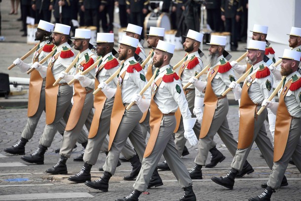 Pioneers of the 1st Foreign Legion regiment carry their axes as they march during the traditional Ba