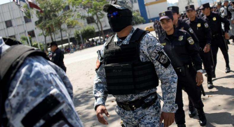 Salvadoran police like those pictured here February 2, struck a heavy blow to the Central American country's violent MS-13 gang, arresting 117 members