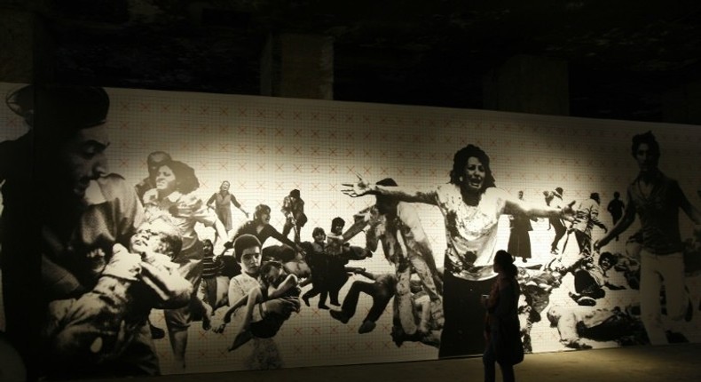 A woman visits a photography exhibition about Lebanon's 1975-1990 civil war in Beirut on April 13, 2010