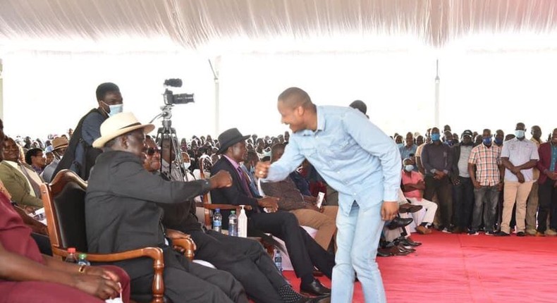 File image of Embakasi East MP Babau Owino sharing a light moment with former Prime Minister Raila Odinga