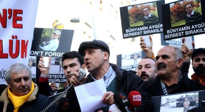 Turkish journalist Ahmet Sik (C) has been detained on accusations of making terror propaganda and denigrating the Turkish Republic, the judicial authorities and police