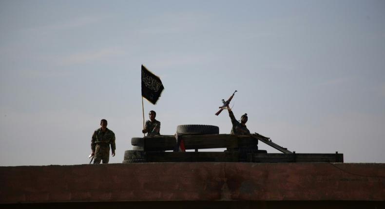 A Syrian youth brandishes his weapon during a last training before being sent to the frontline along with rebel fighters from the Jaysh al-Islam brigades (Army of Islam) in Eastern al-Ghouta in 2014